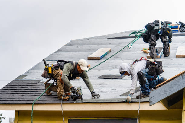 Professional Gutter Installation technician working in Arlington, OR